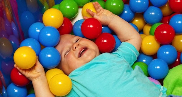 baby with play balls